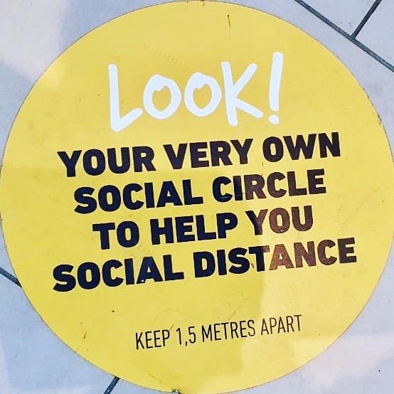 Floor decal that says: Look! Your very own social circle to help you social distance.